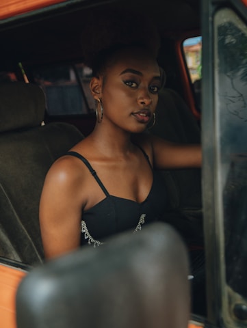 Young woman sitting in a car