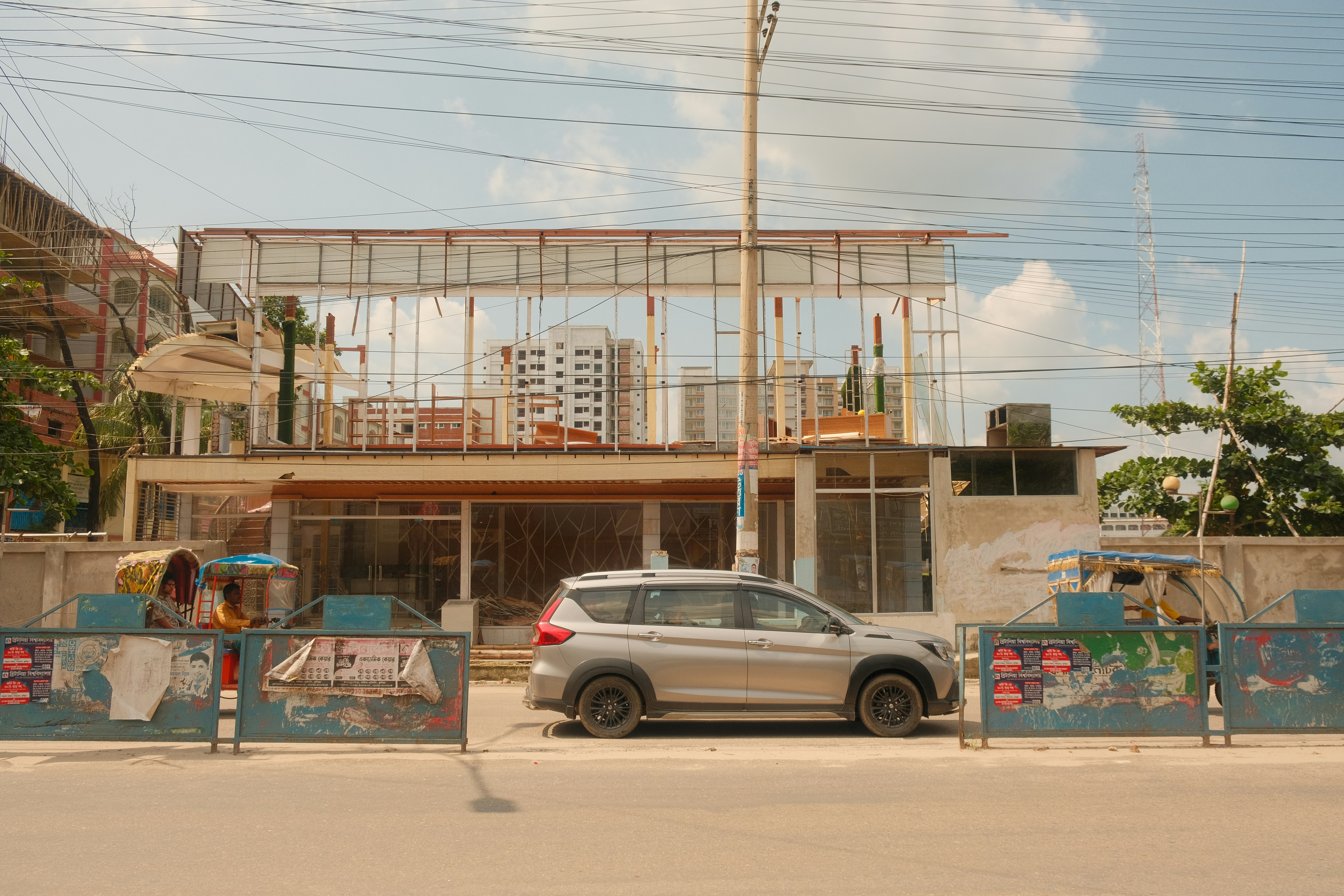 Silver car parked in front of a building