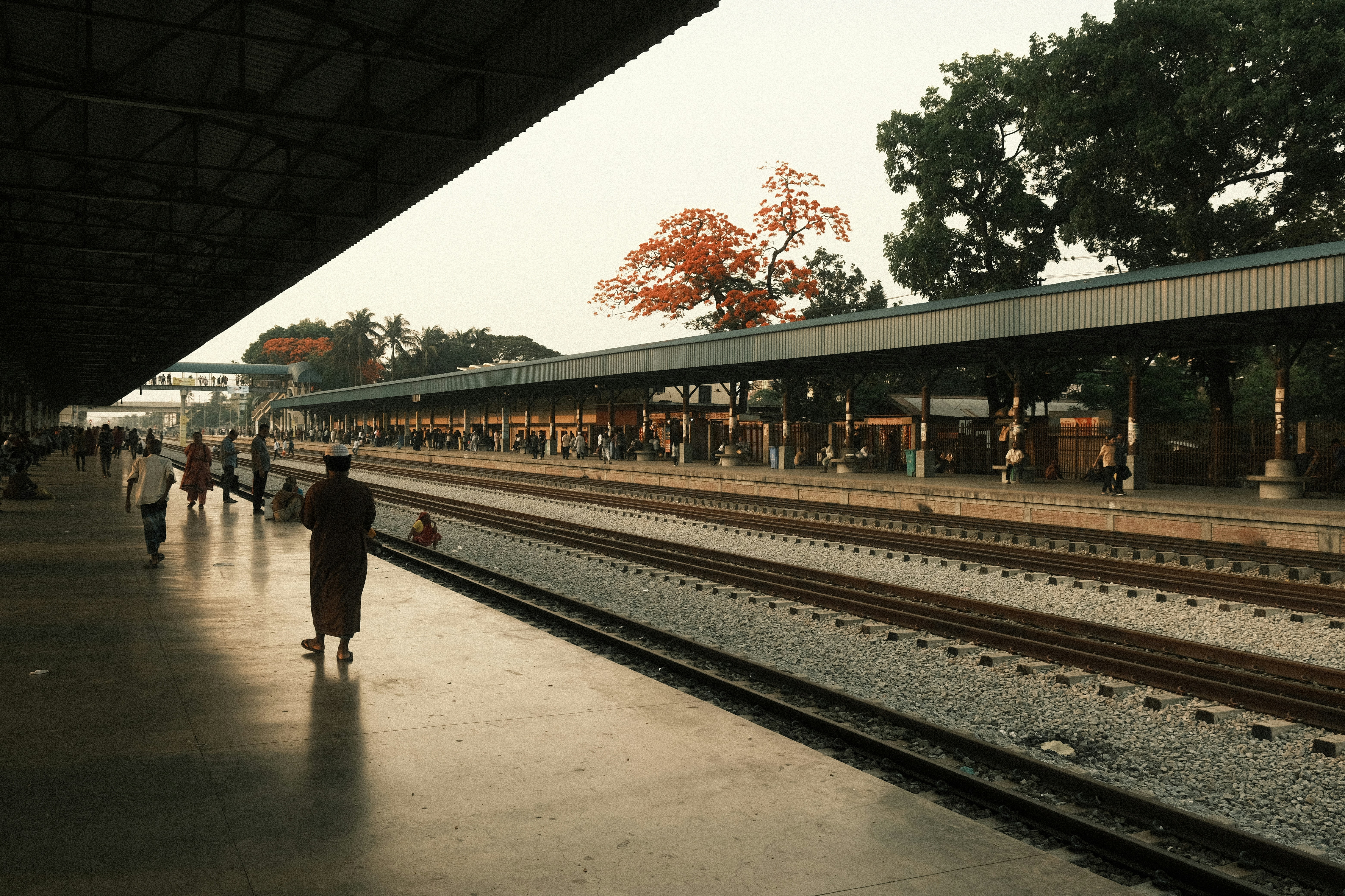 People walking on a train station platform