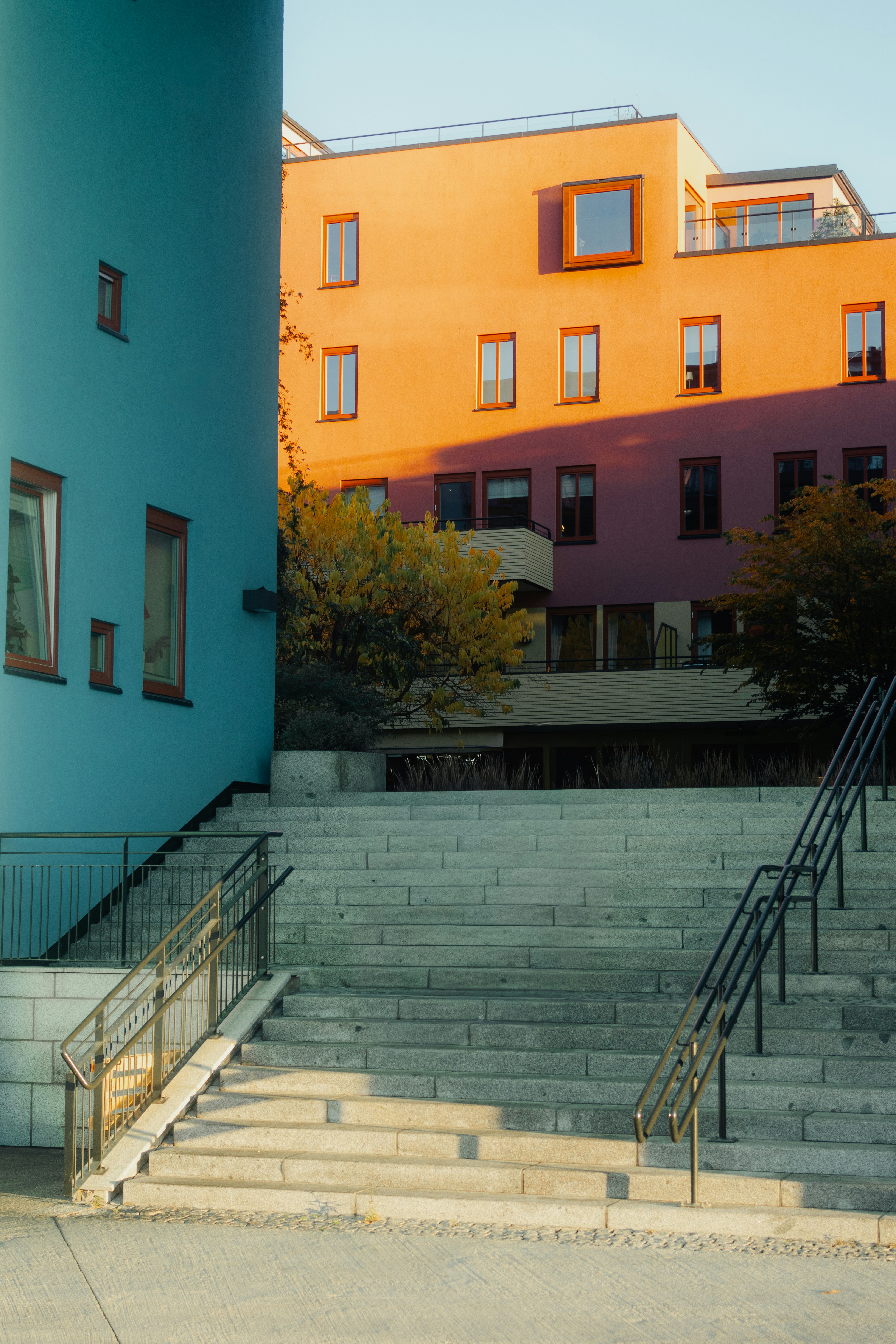 Modern buildings with colorful facades and outdoor stairs