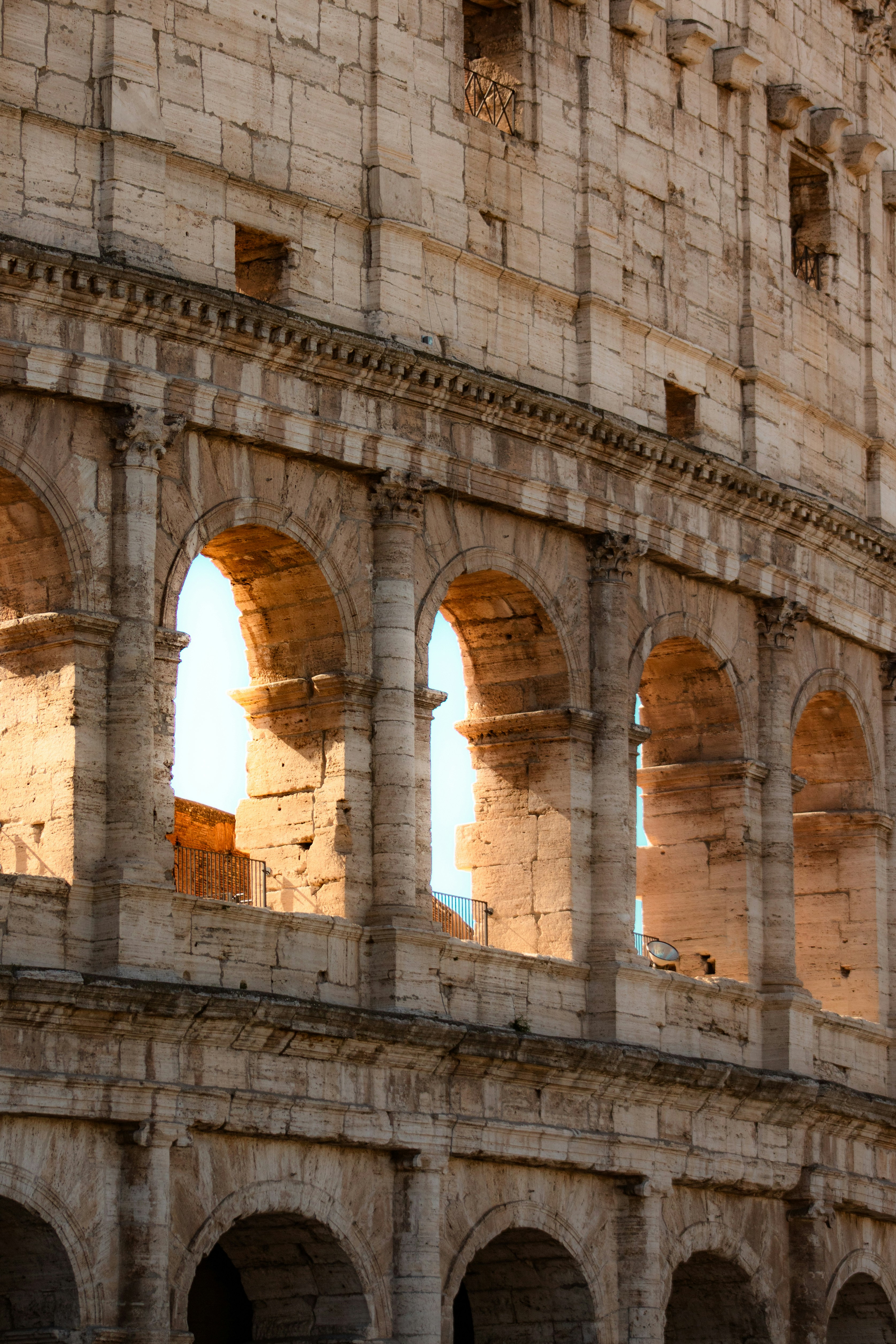 Close-up of the arches of the colosseum in rome.