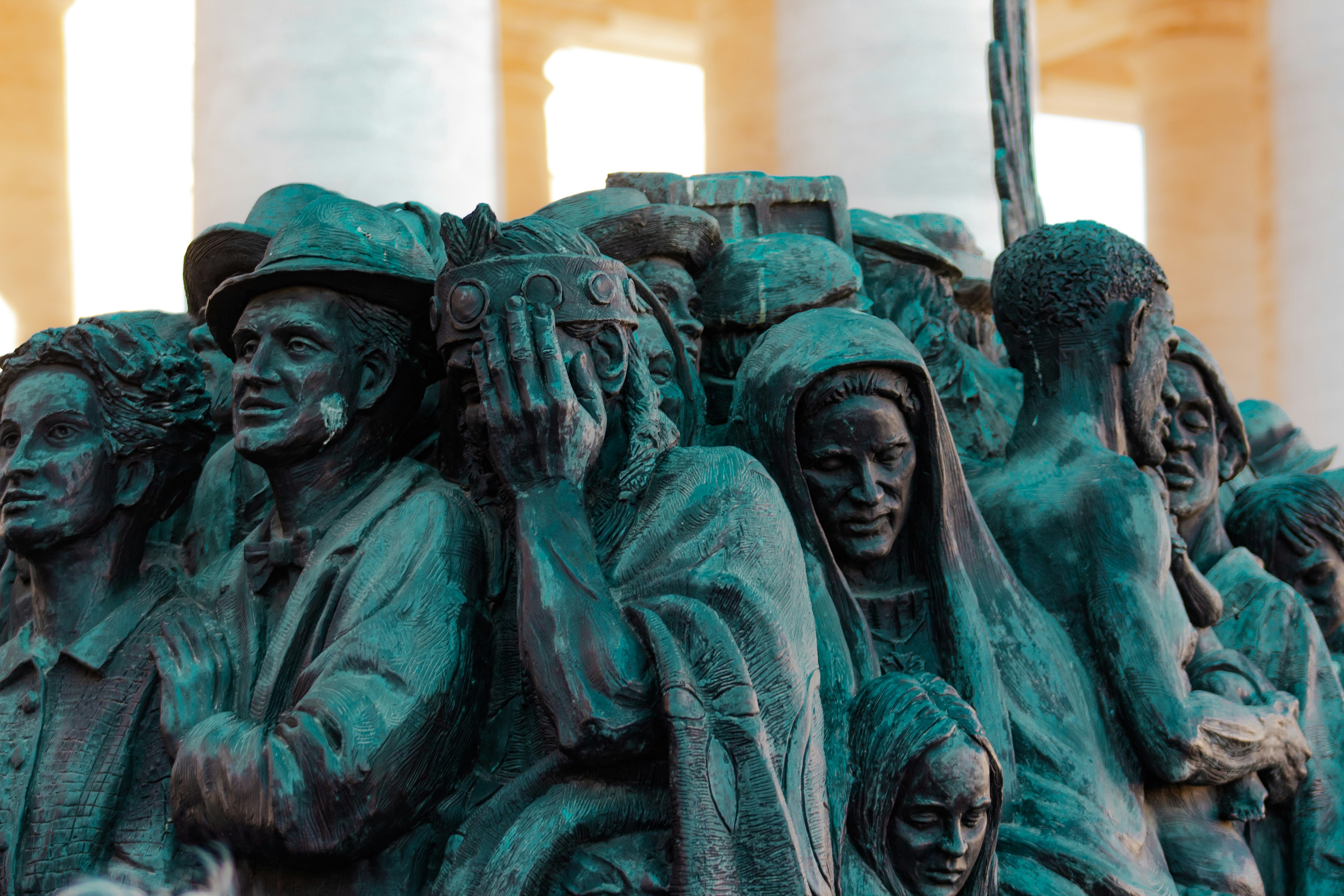 Sculpture of distressed people in a crowd