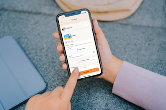 Person using a smartphone with travel app open