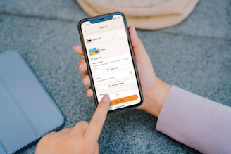 Person using a smartphone with travel app open