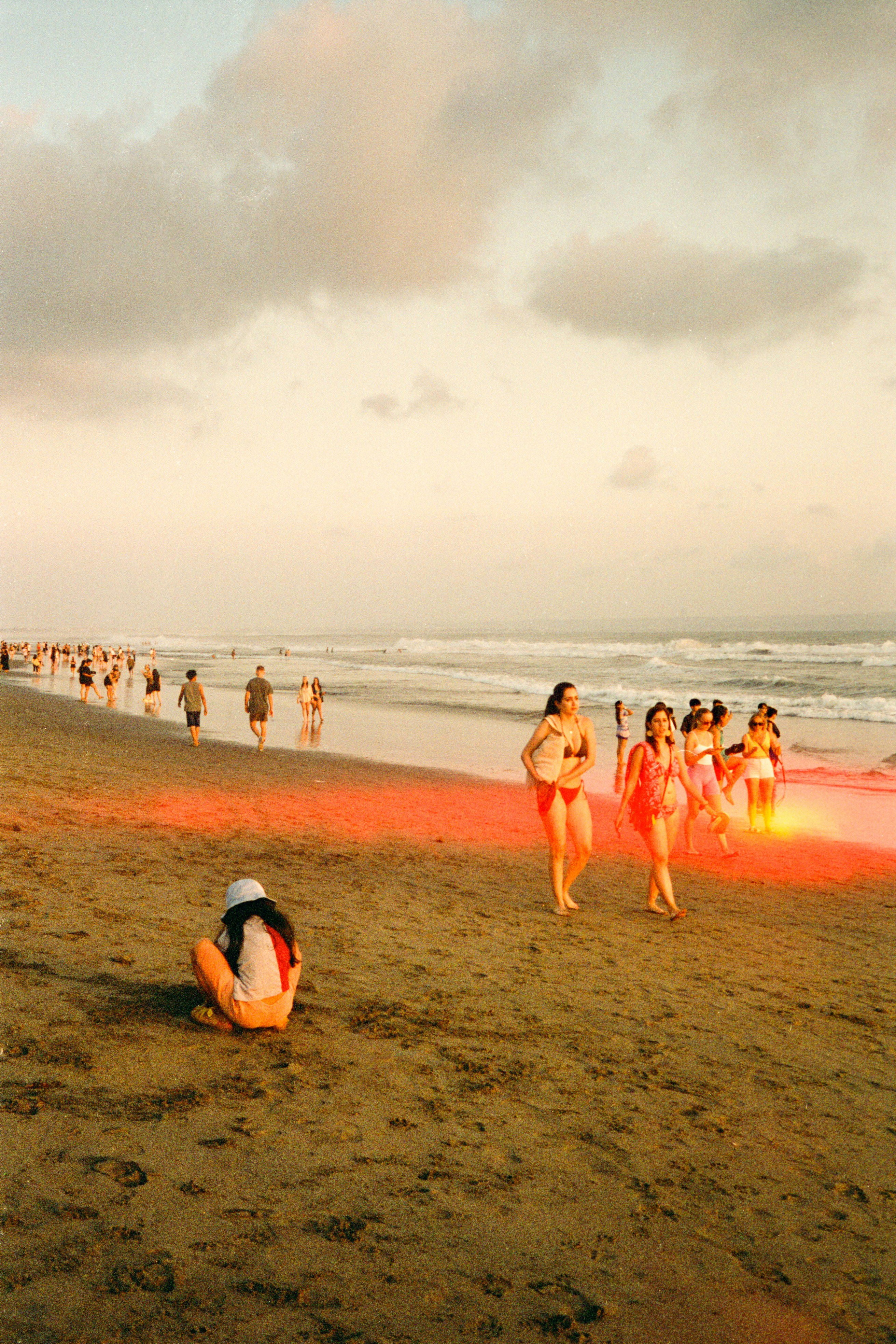 Cinestill 400d 🎞️ | People walking on a sandy beach at sunset