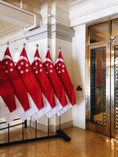 Row of singapore flags displayed indoors