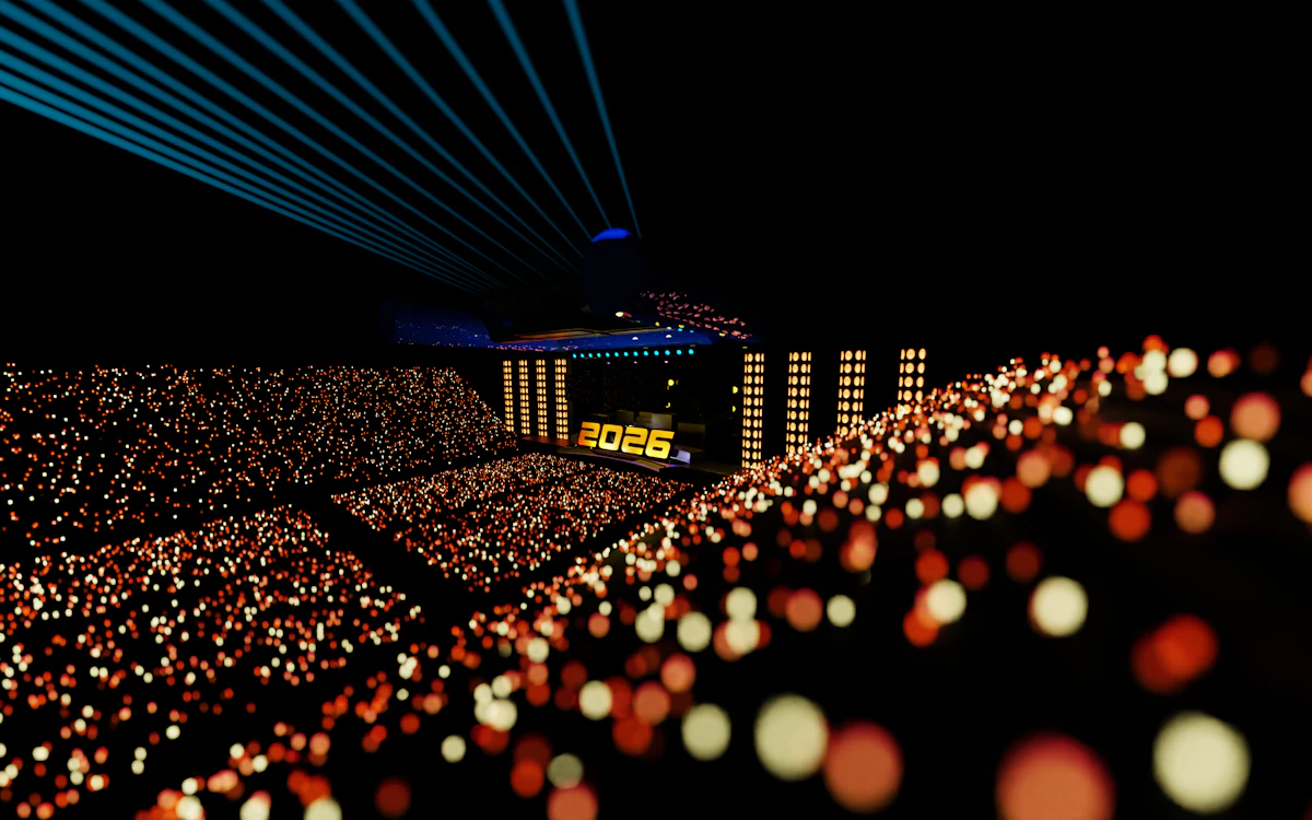 Large concert arena with dramatic laser beams and audience lighting