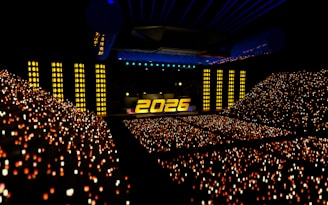 A concert arena filled with cheering fans at year 2026.