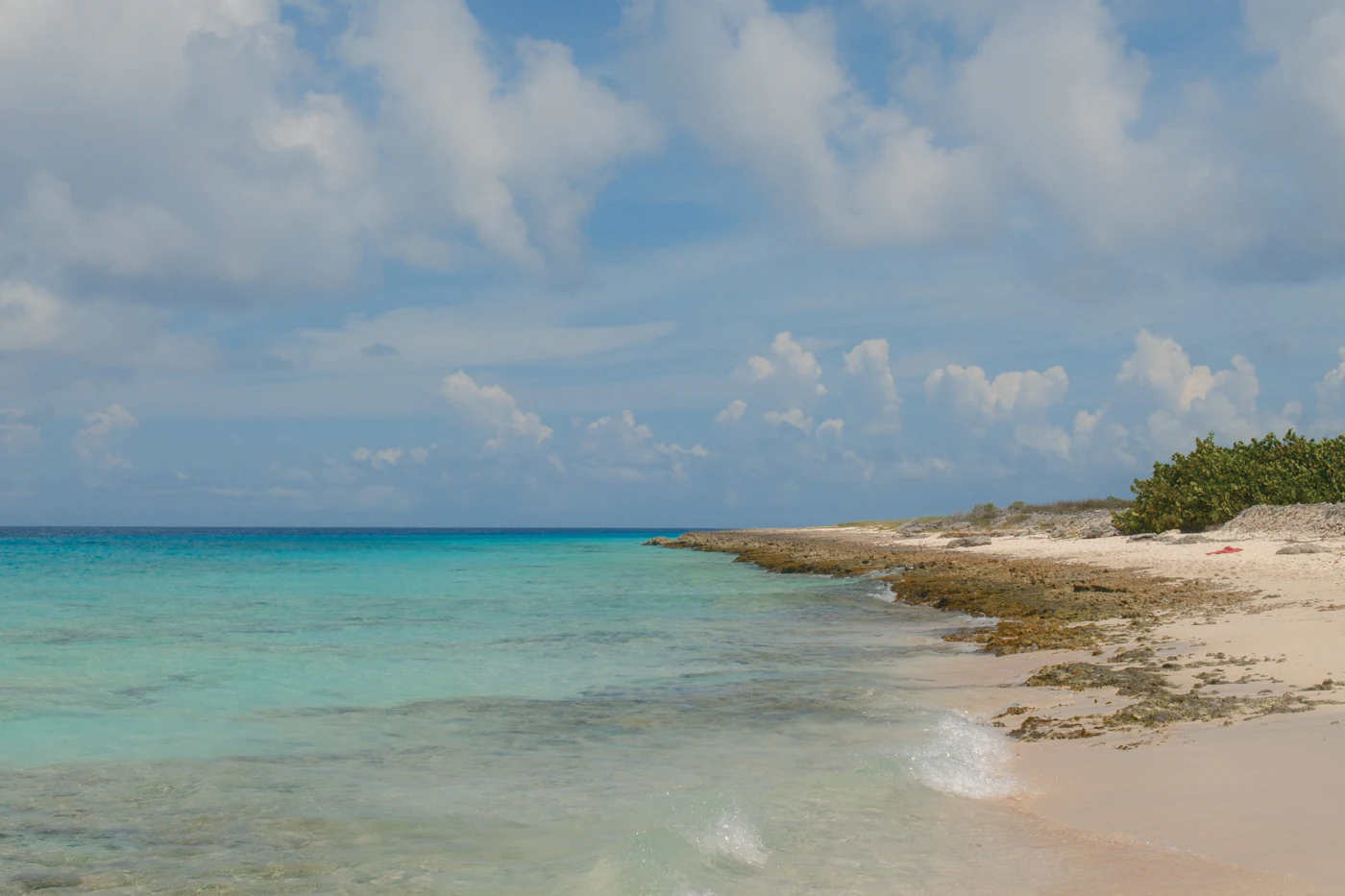 A turquoise Caribbean cove with white sand
