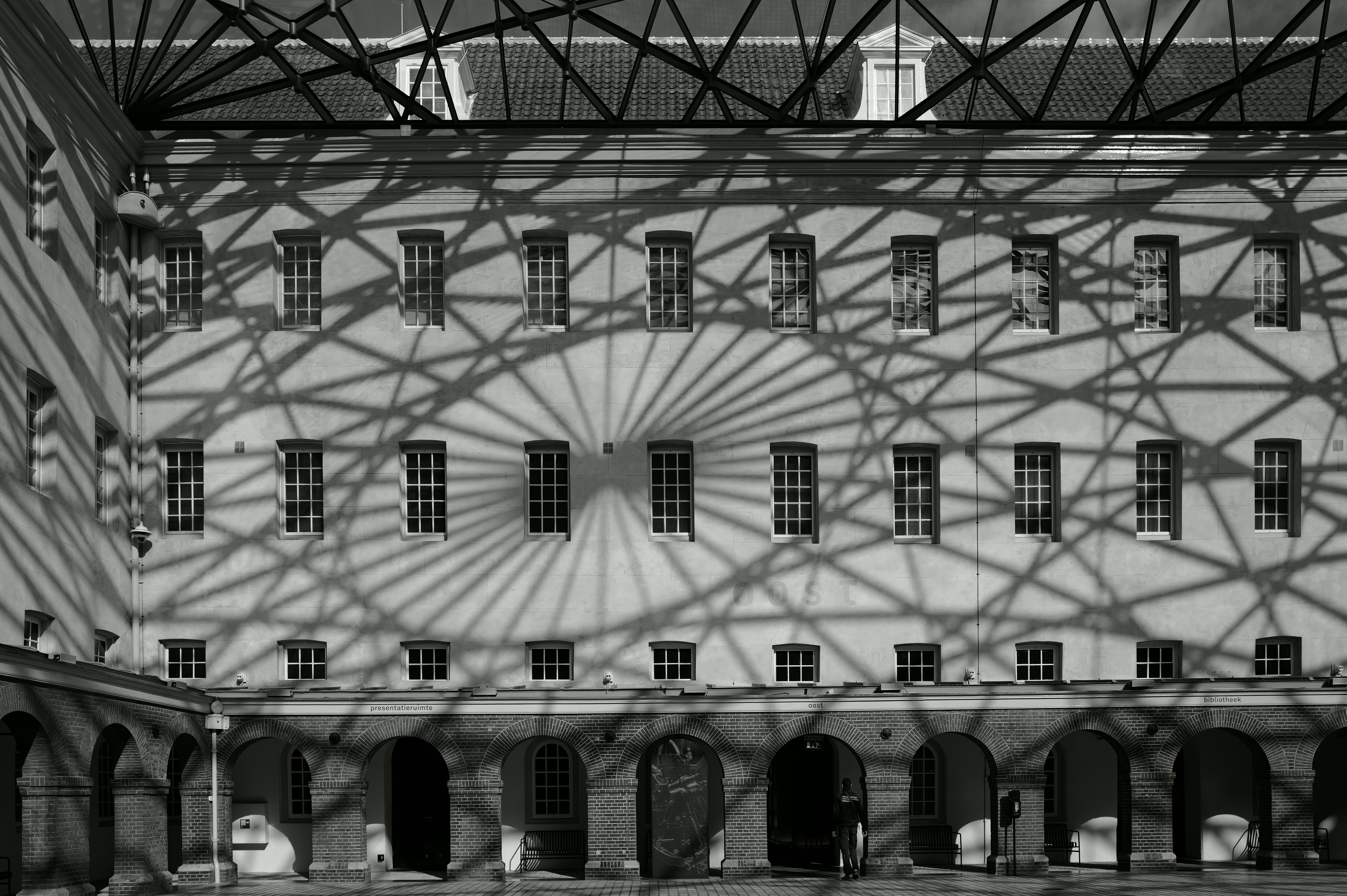 Building interior with geometric shadow patterns on wall