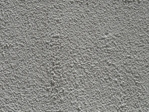 Close-up of a rough grey textured wall