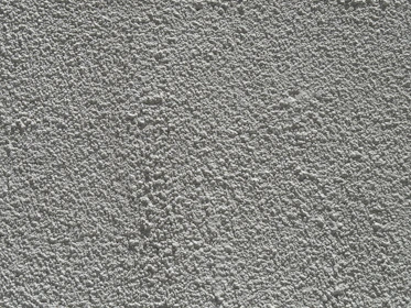 Close-up of a rough grey textured wall