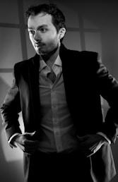 Man in suit looking away from camera