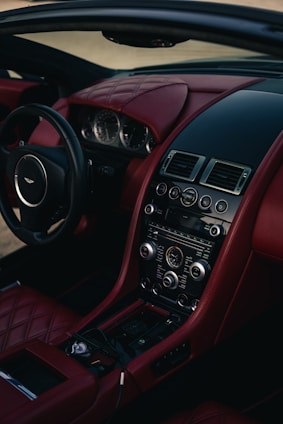 Luxury car interior with red leather seats.