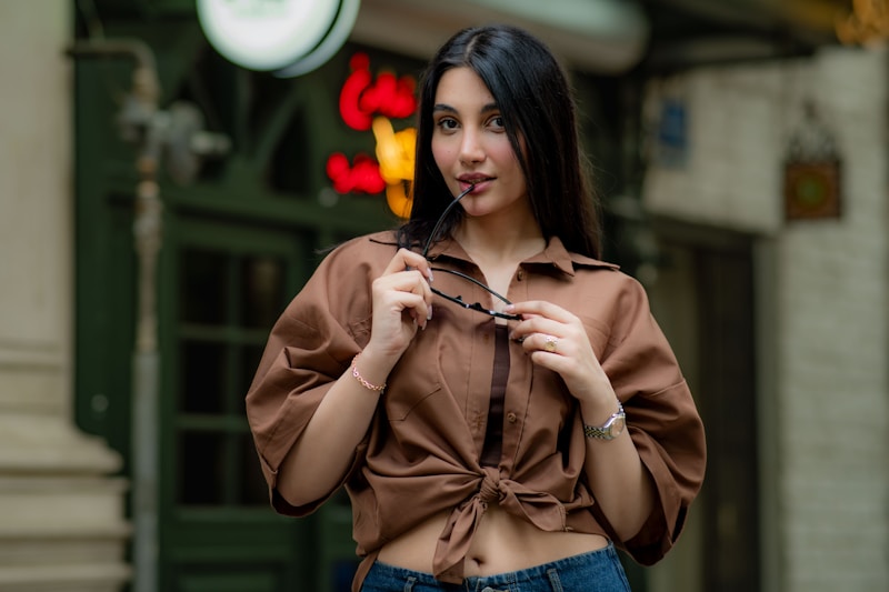 Trendy sugar mama with sunglasses at storefront