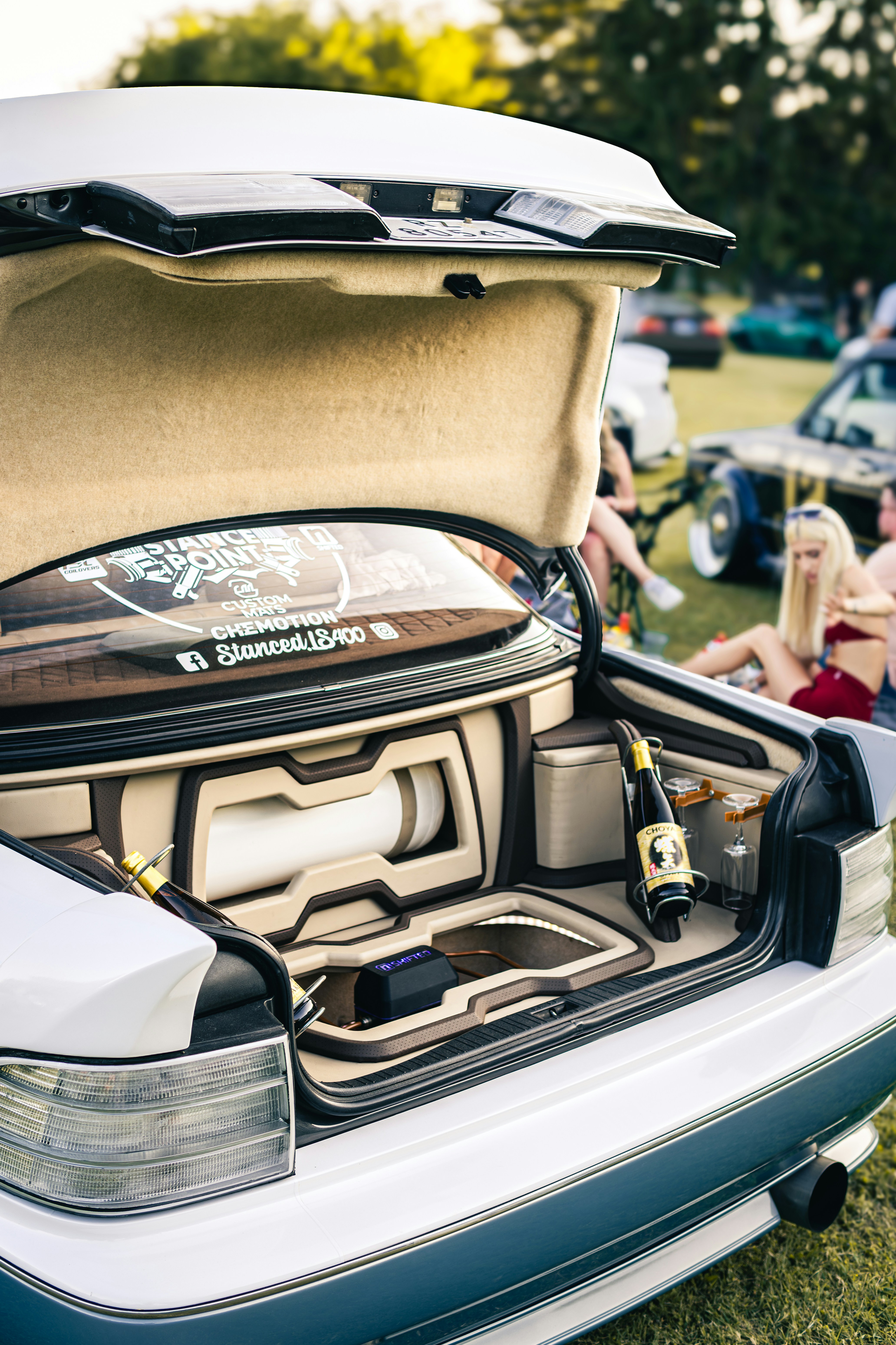 Custom car trunk with sound system and champagne.