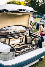 Custom car trunk with sound system and champagne.