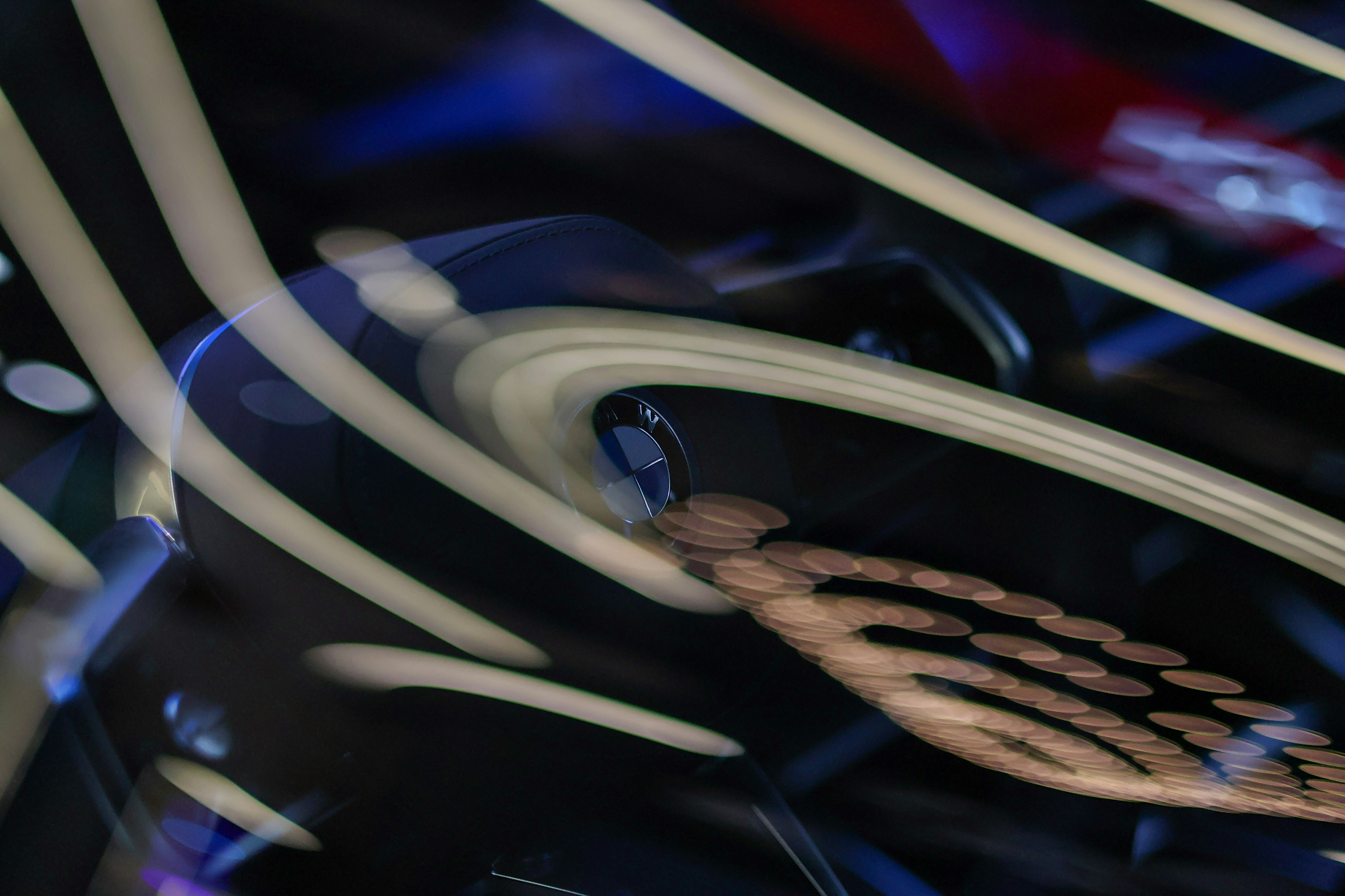 Abstract conceptual rendering of silicon wafer merging with automotive dashboard schematics