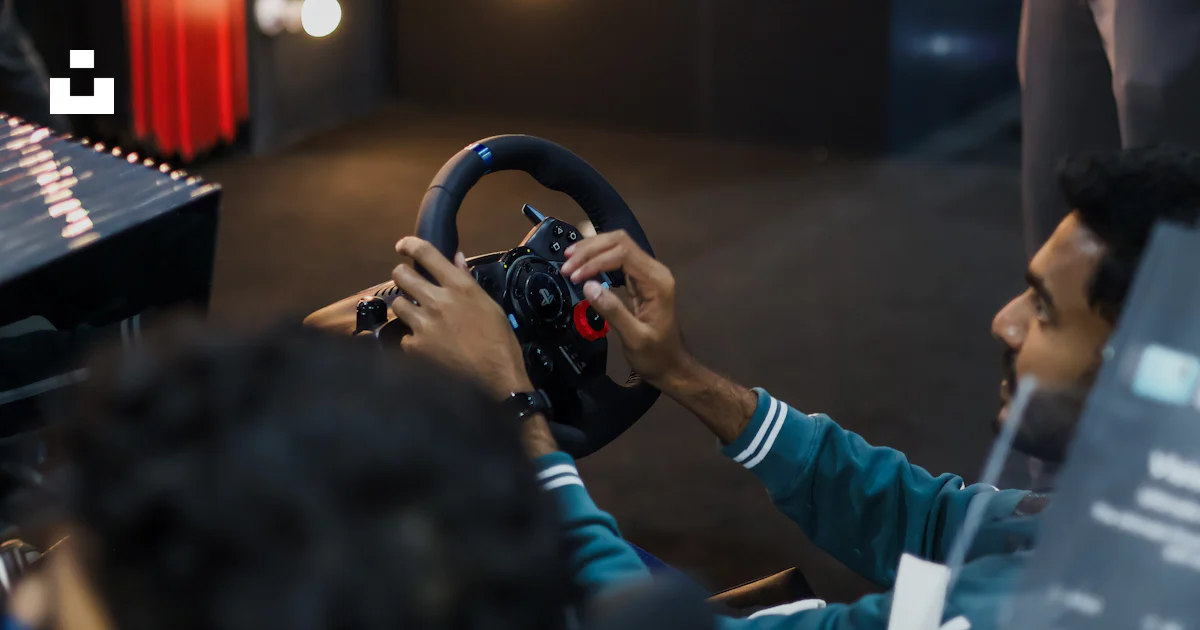 Car Simulation Man Man playing racing simulator with steering wheel photo – Free ...