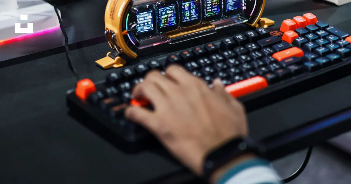 Gamer typing on a futuristic keyboard with multiple screens. photo ...