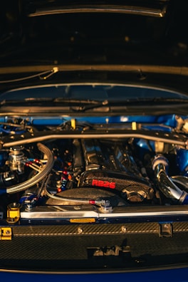Close-up of a blue car engine with "rb25" label.
