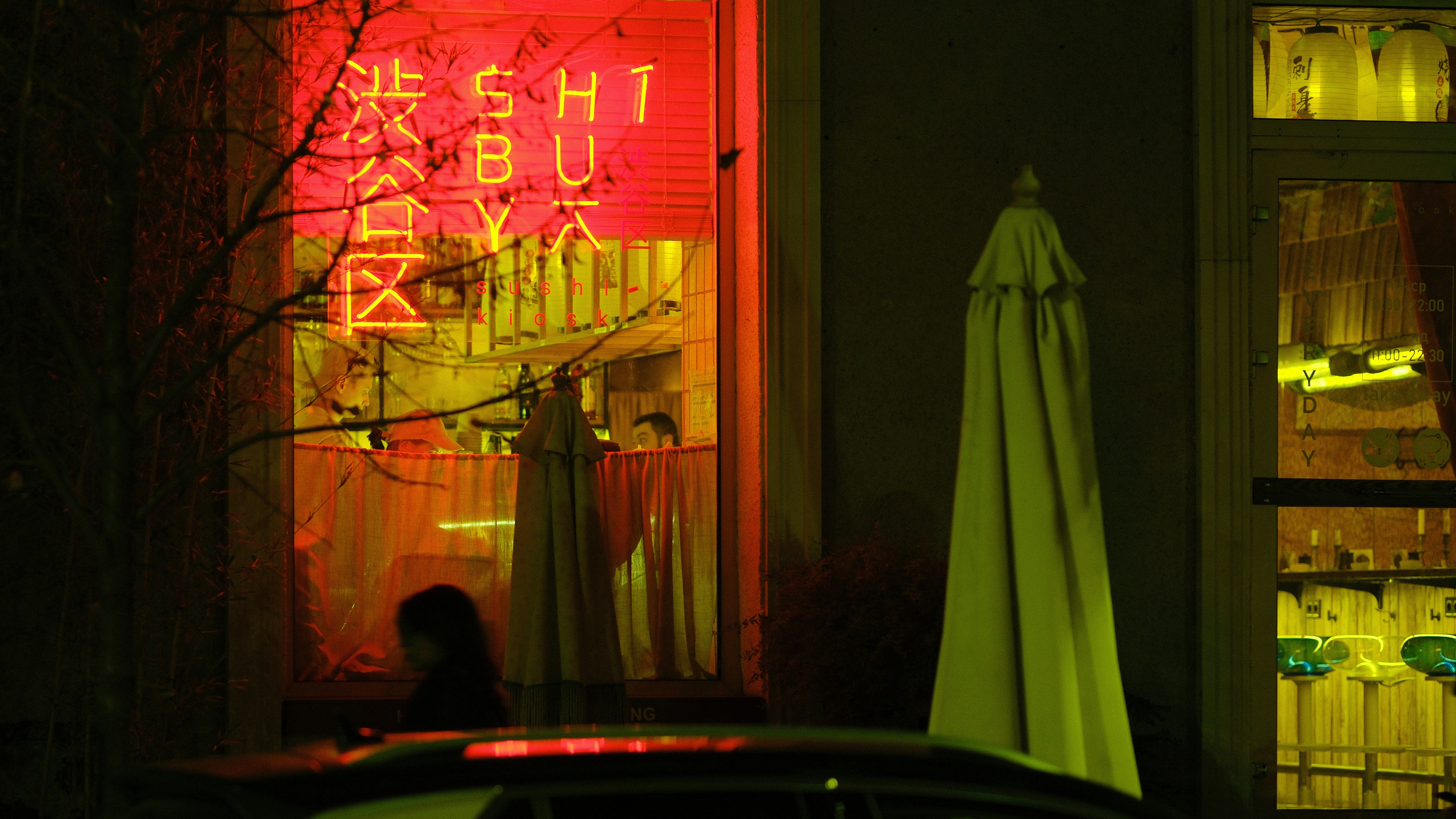 Neon sign in a window at night