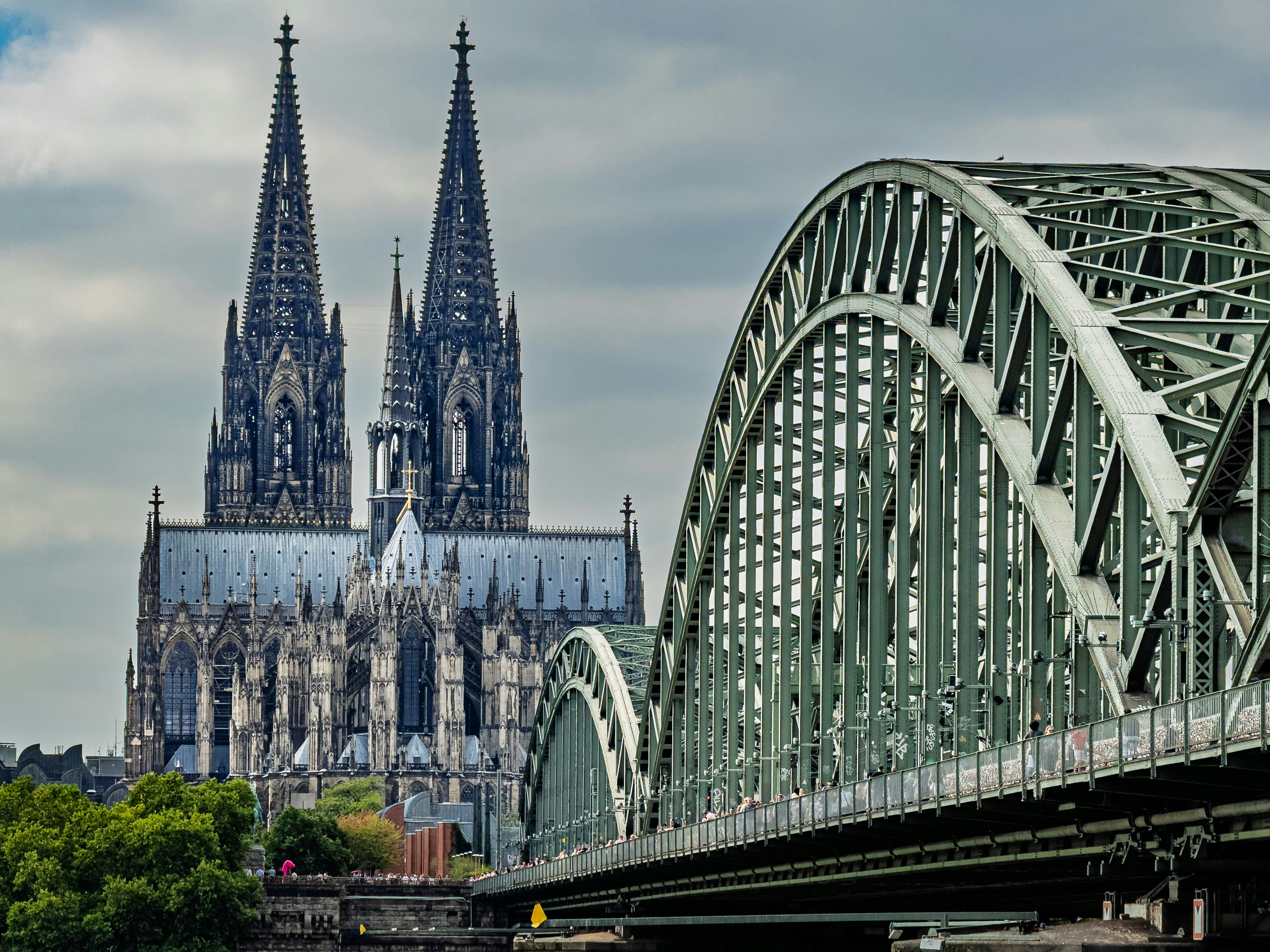 Cologne cathedral and hohenzollern bridge over rhine river