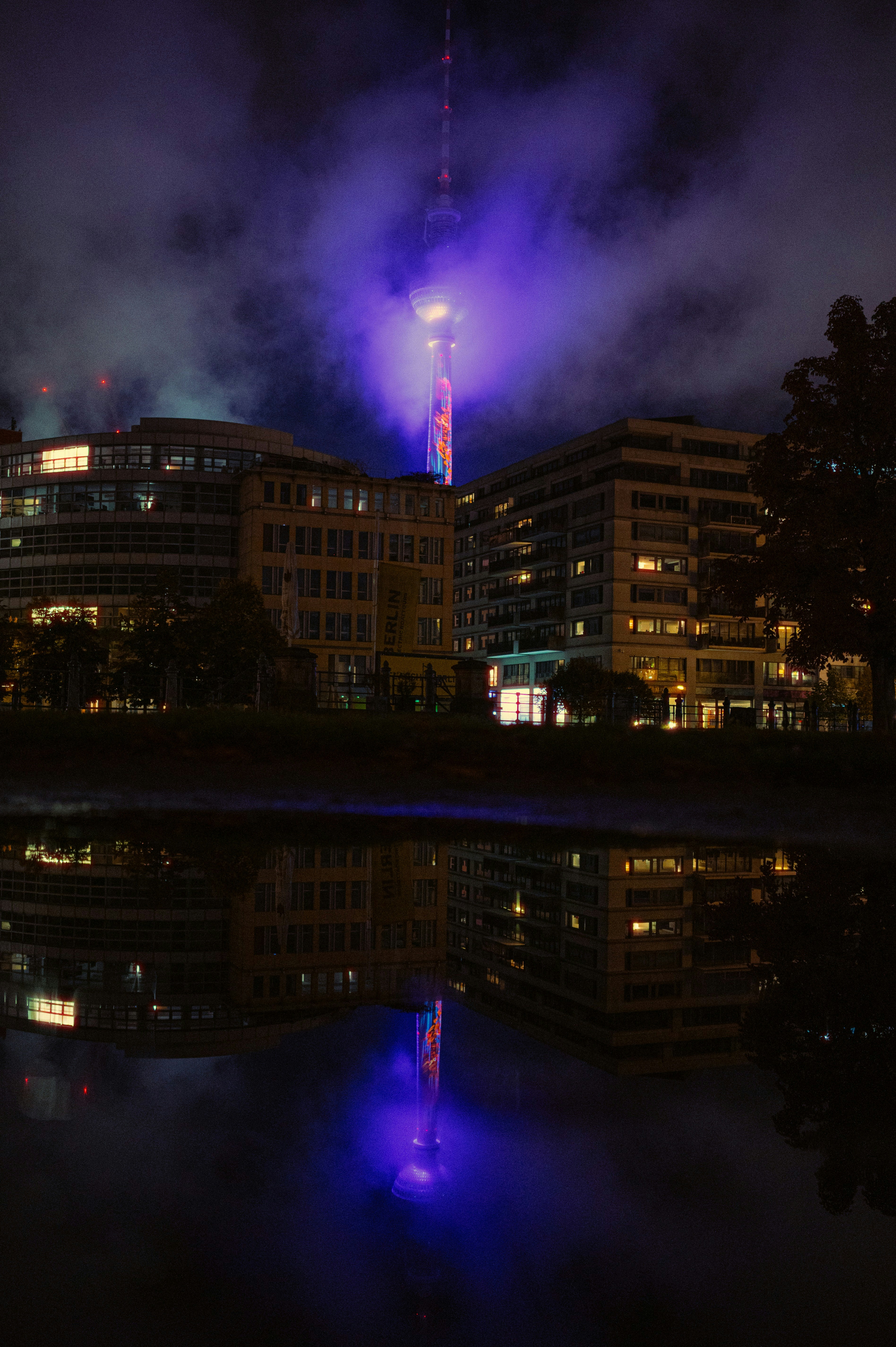 City skyline with a tall tower at night