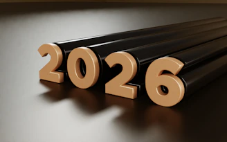 Golden 2026 numbers on a dark reflective surface