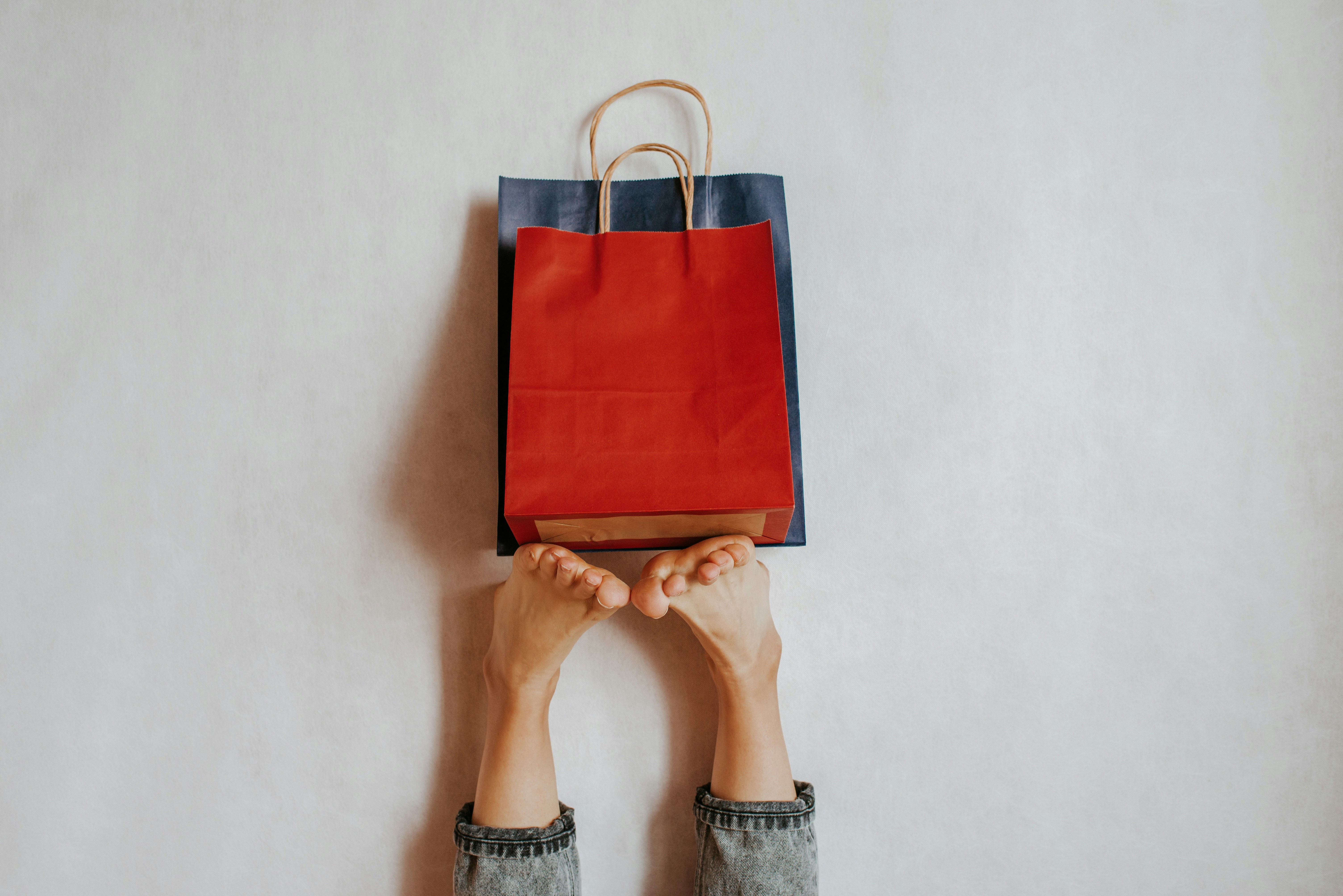 Happy woman holding shopping package