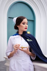 Nurse in uniform holding a golden lamp
