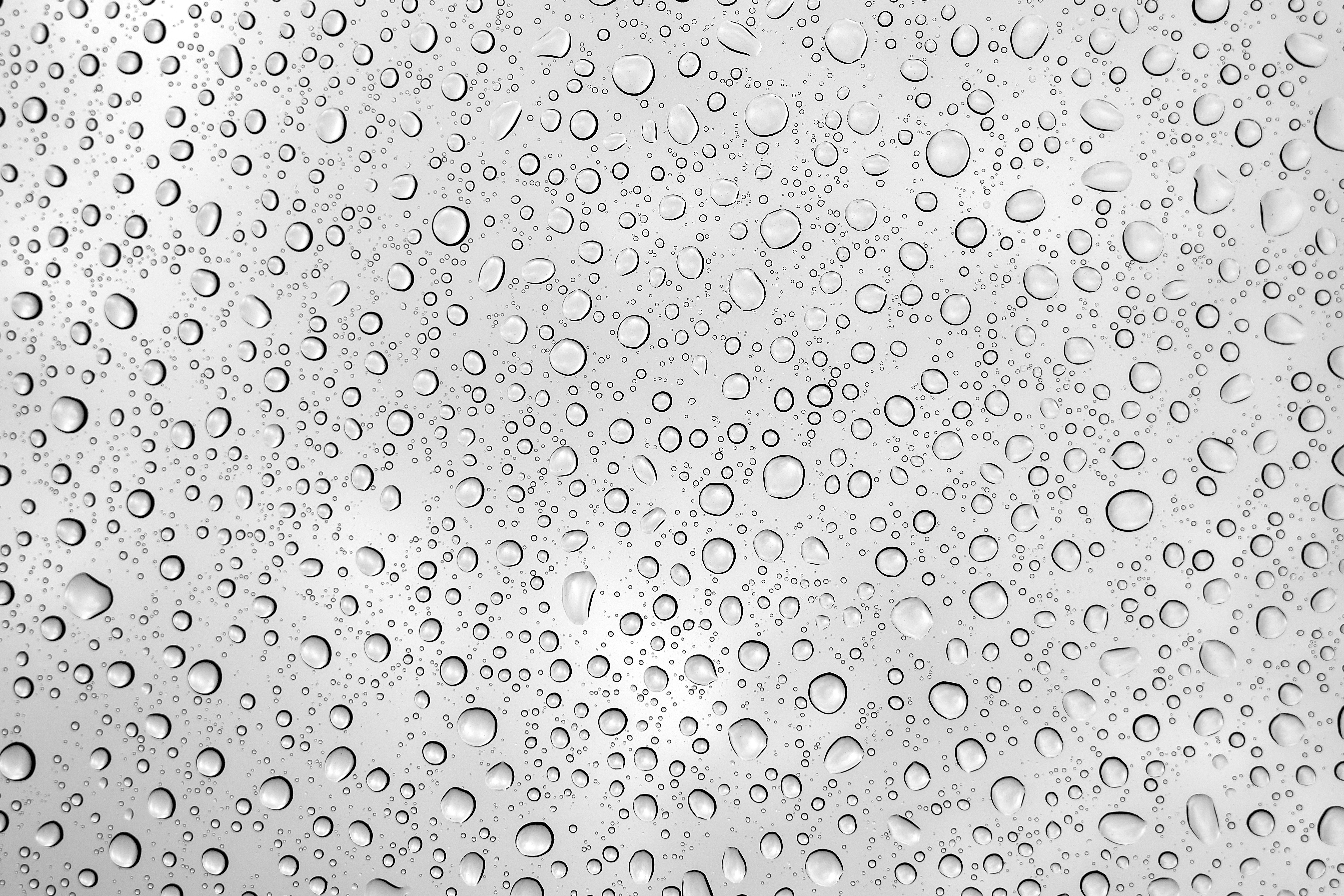 Woman applying hydrating moisturizer to her face.