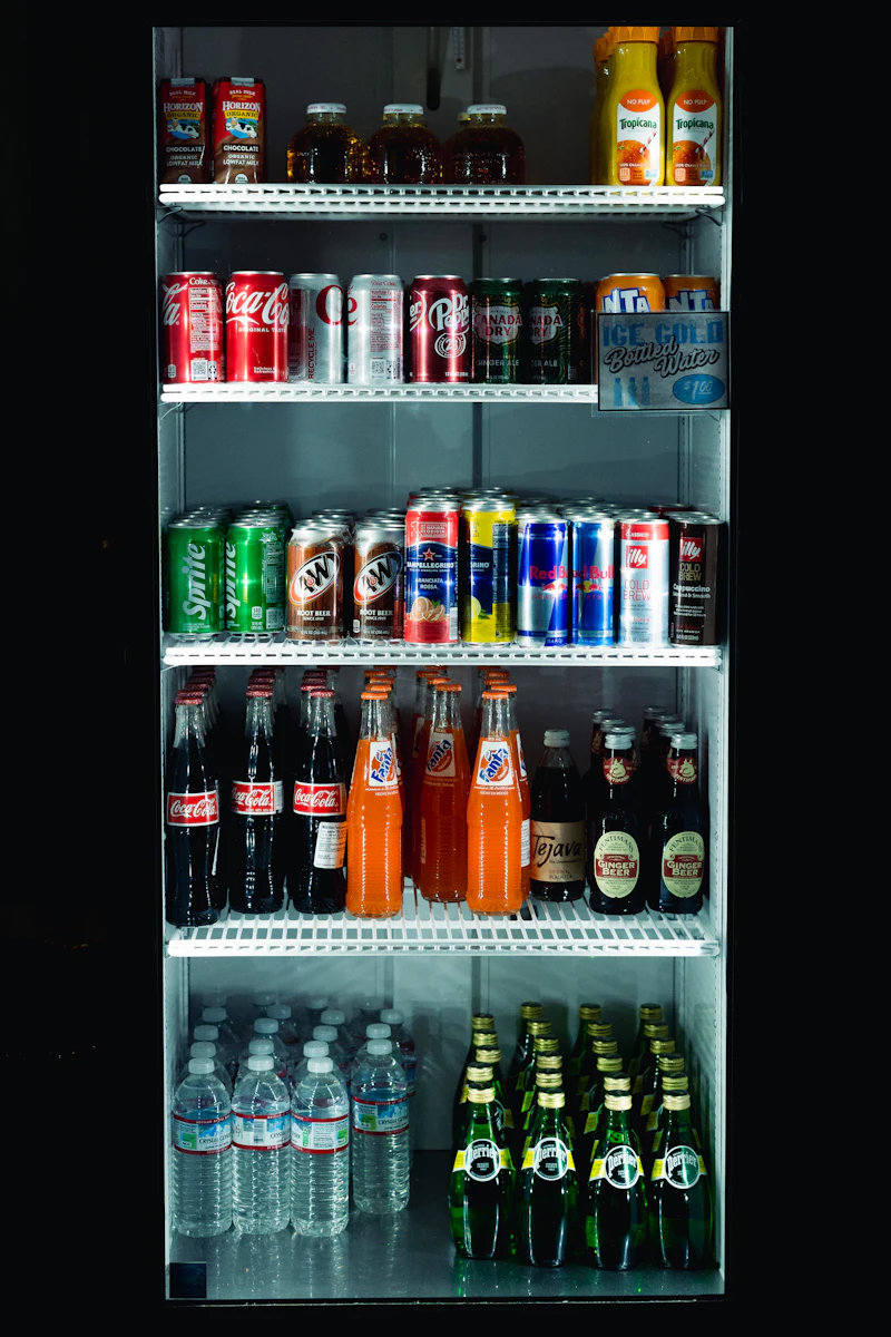 Chilled fridge shelving stocked with drinks