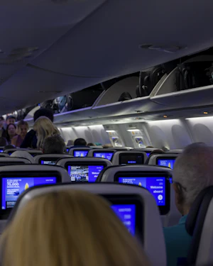 Airplane cabin interior with seat-back screens