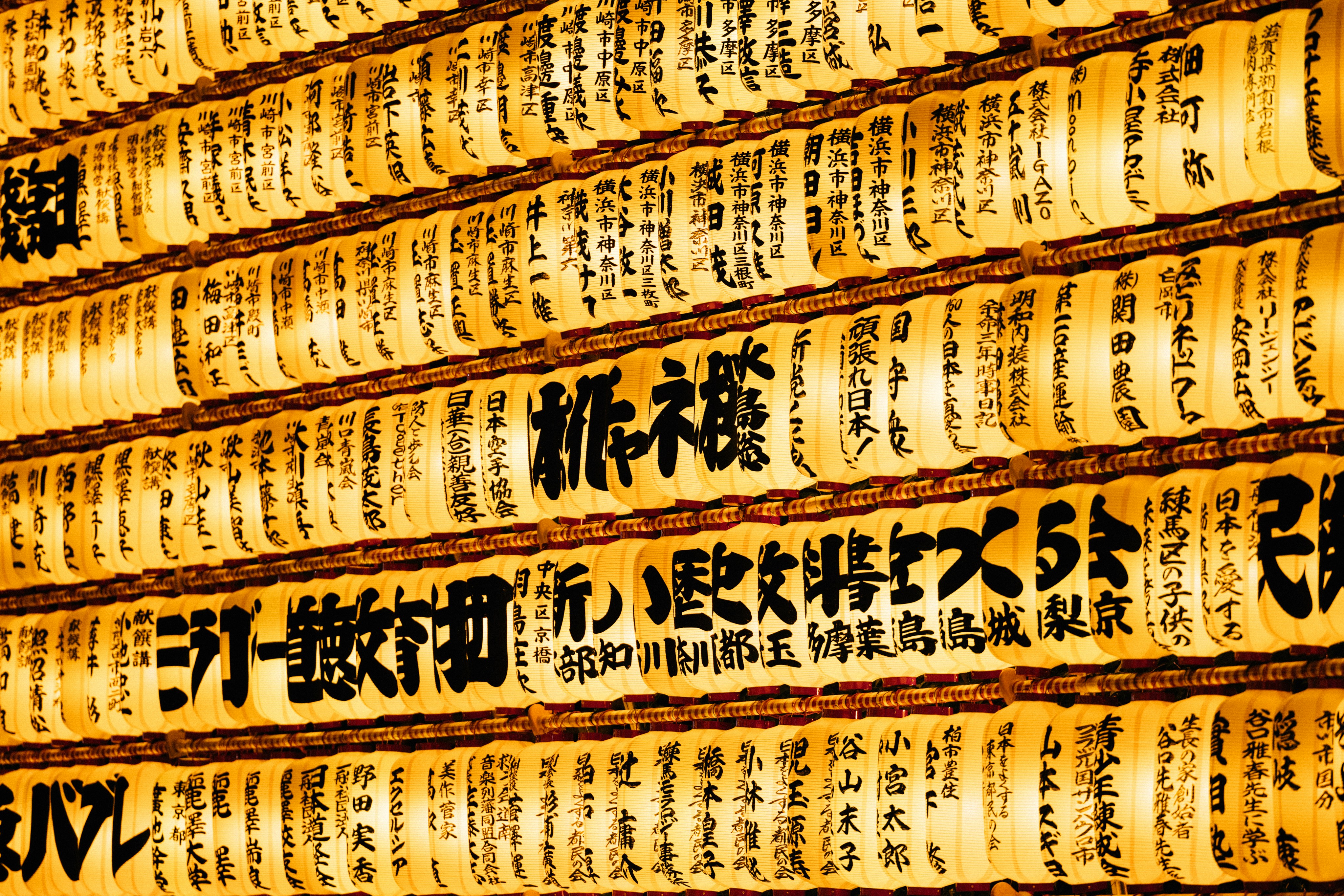 Japanese matsuri festival with glowing lanterns and traditional shrine gates at night
