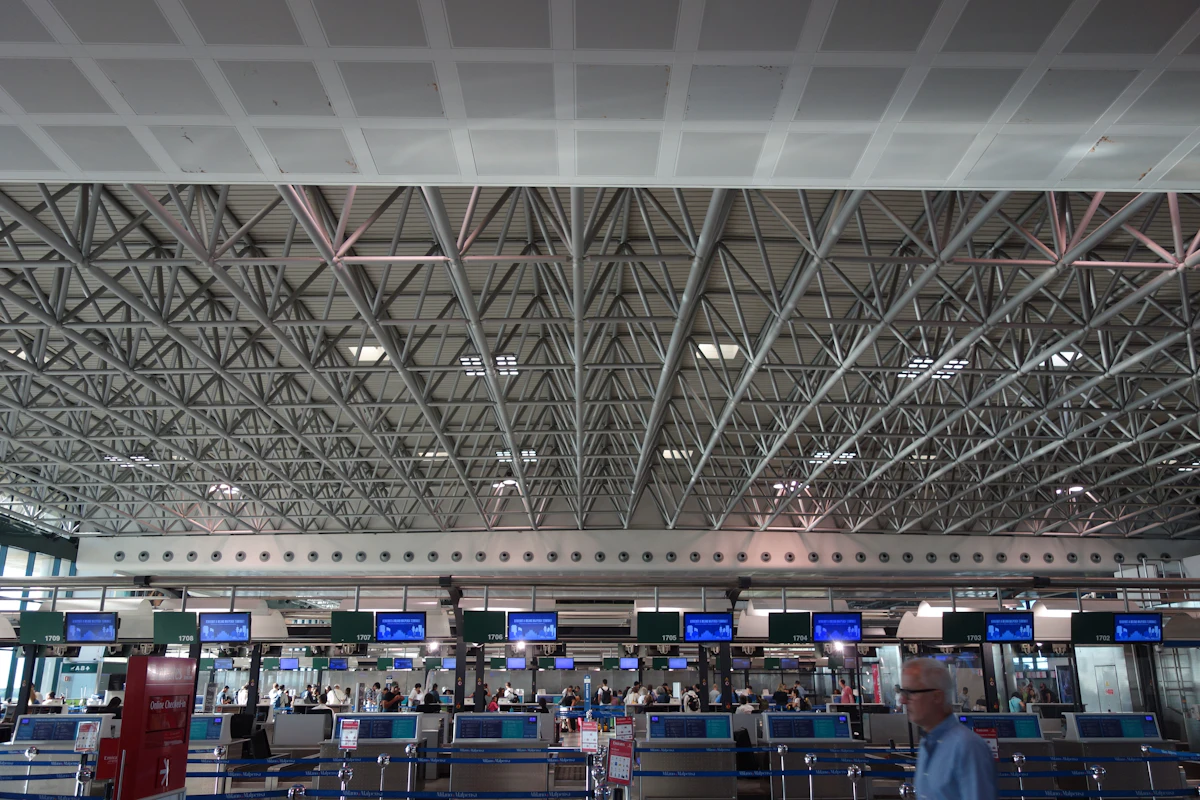Modern airport check-in counters with electronic displays