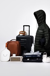 Collection of travel gear and clothing items on-the-go essentials