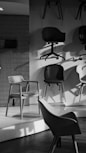 Various chairs displayed in a showroom setting.