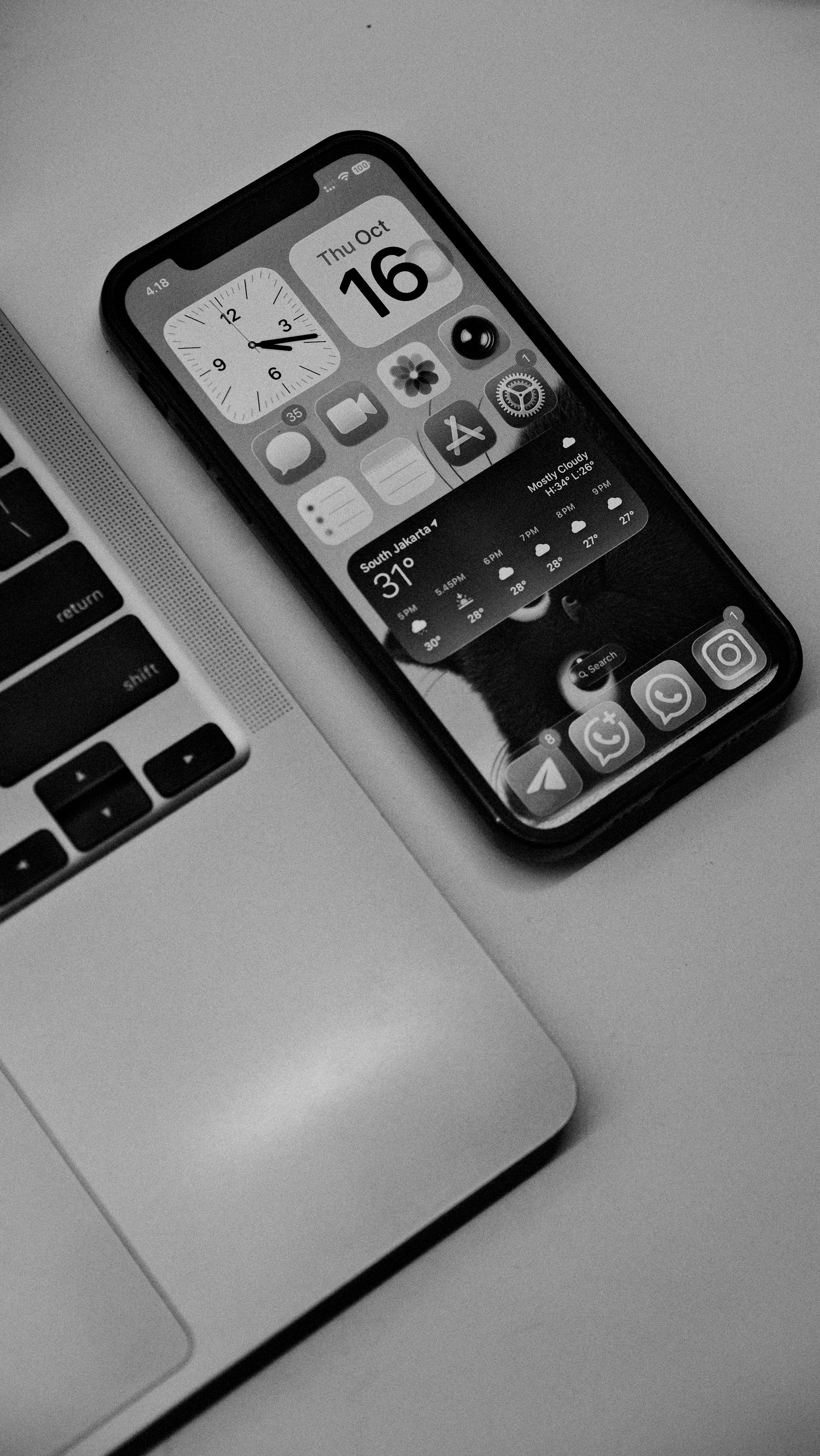 Smartphone and laptop on a flat surface