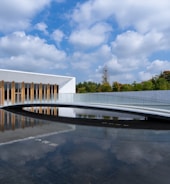 Modern building with reflection in water