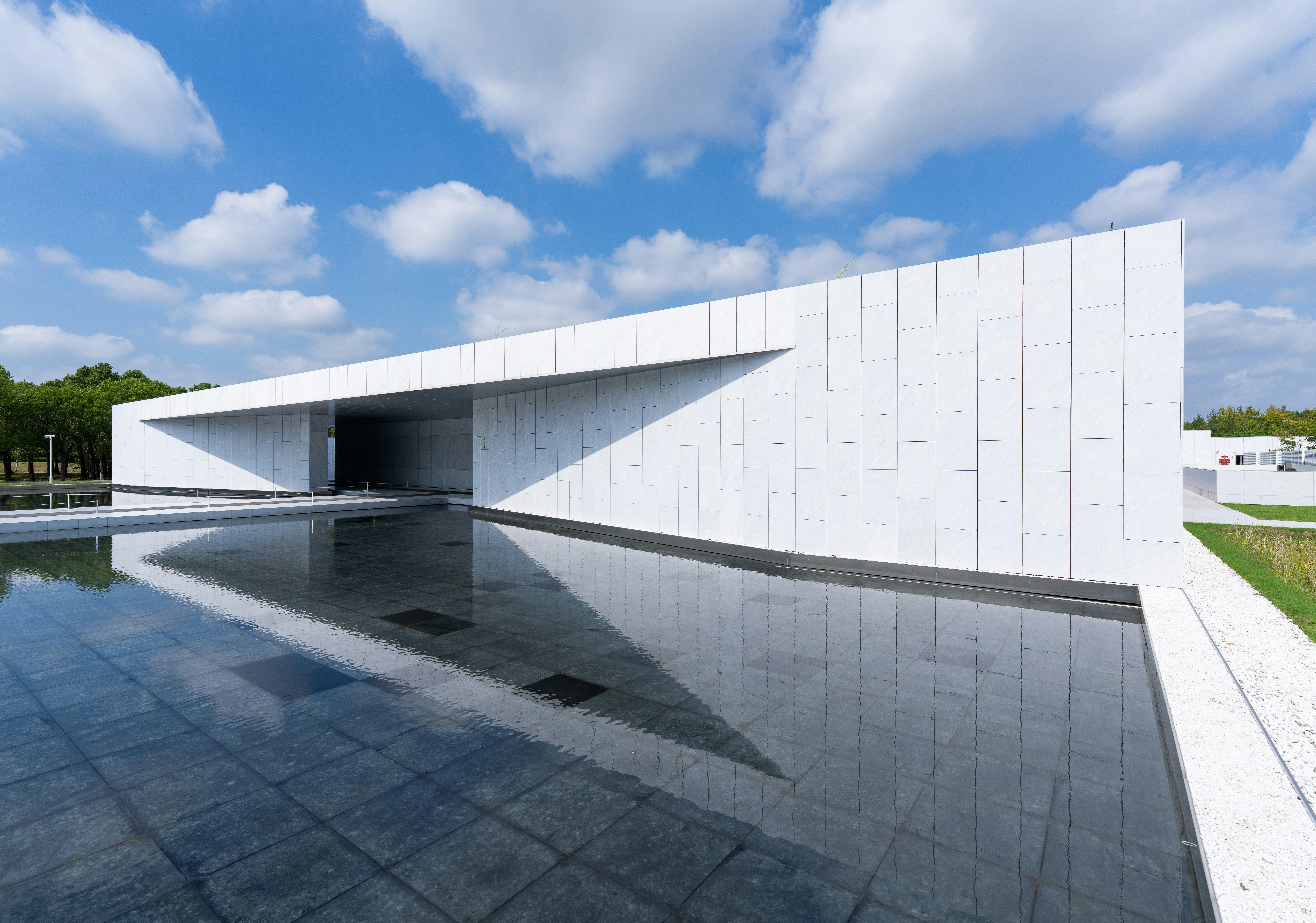 customs clearance concept - Modern white building reflected in calm water