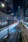 City street with light trails at night.