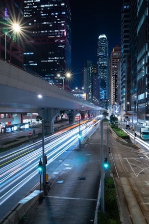 City street with light trails at night.