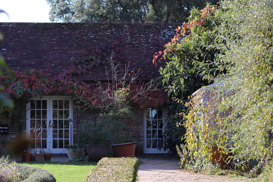 Cottage with French doors opening to a garden