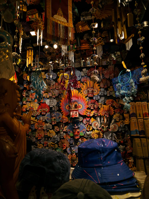 Colorful masks and wind chimes hanging in shop