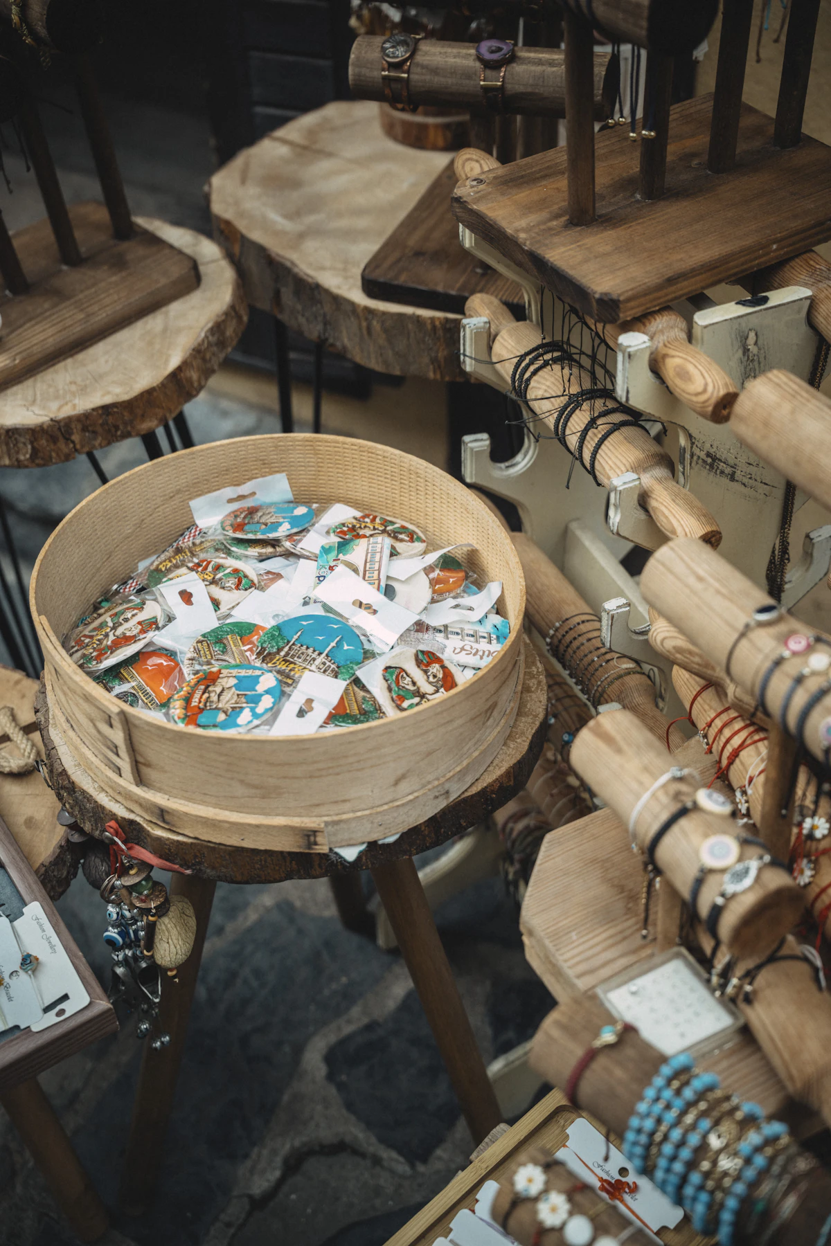Wooden display of handmade jewelry and trinkets