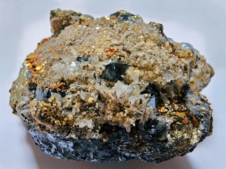 A cluster of metallic mineral ore with quartz crystals.