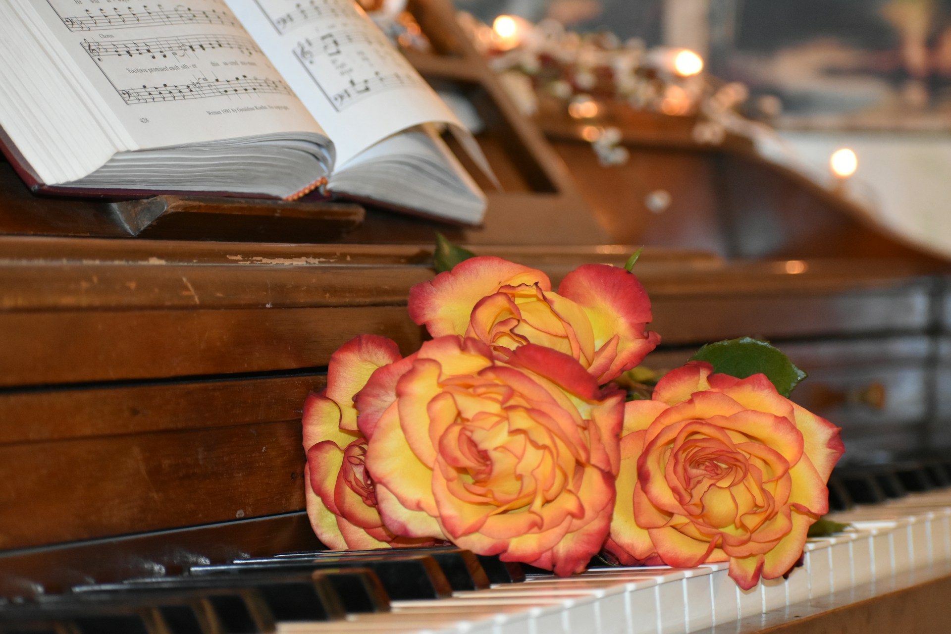 Roses on a piano with sheet music