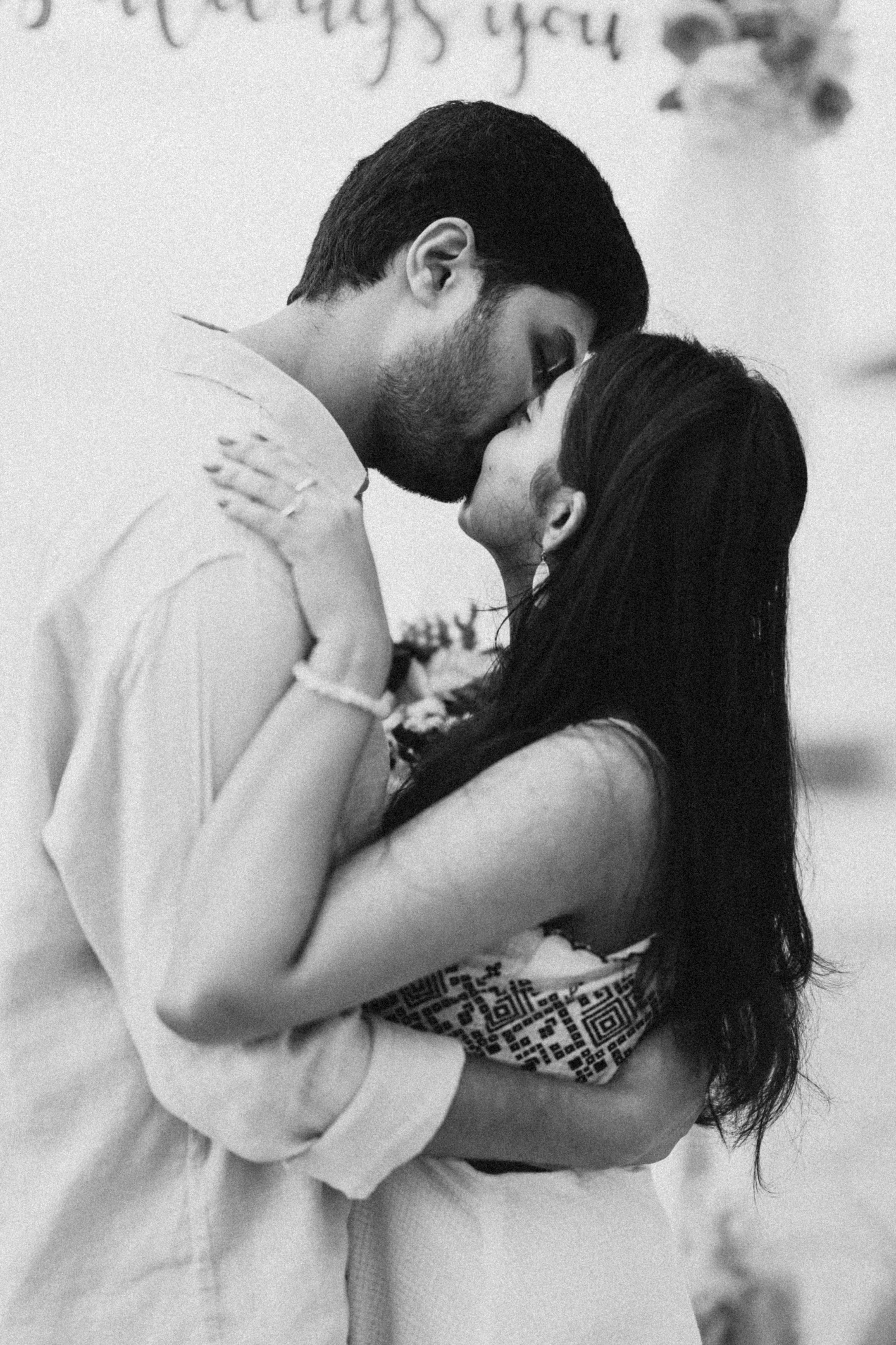 A couple kissing in a tender embrace