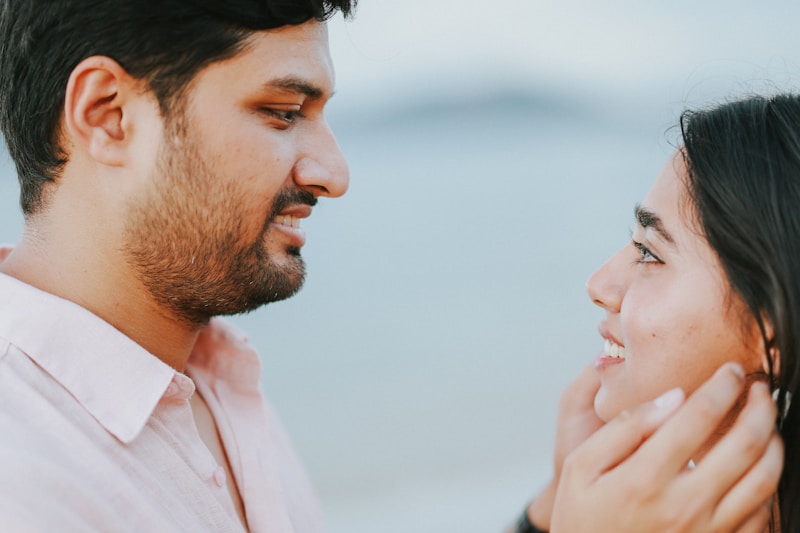 Gay couple looking at each other with smiles
